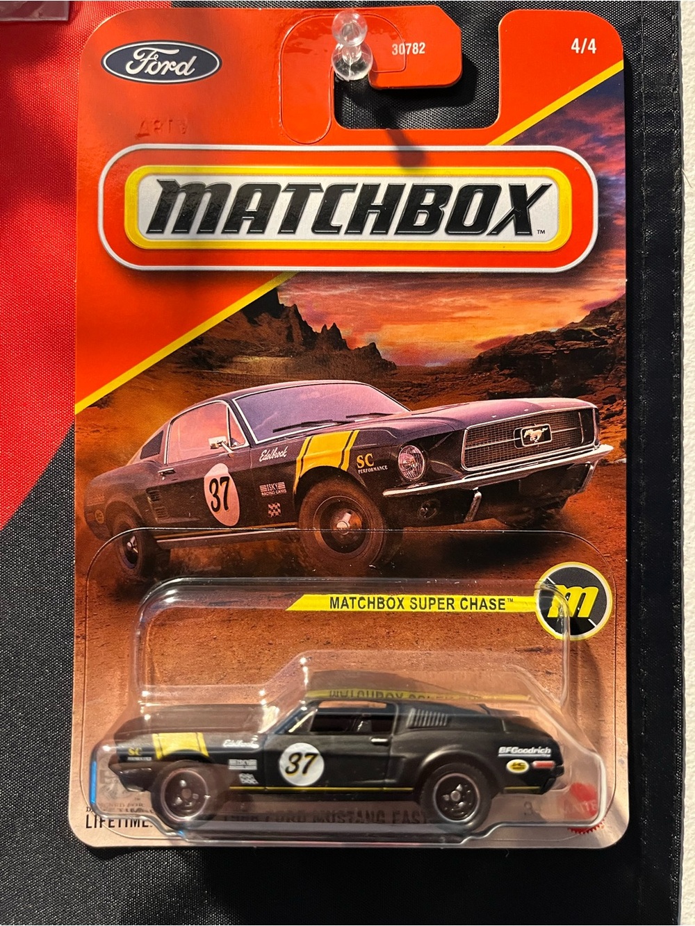 Match Black Ford Mustang Fastback Toy Car with Yellow Racing Stripes